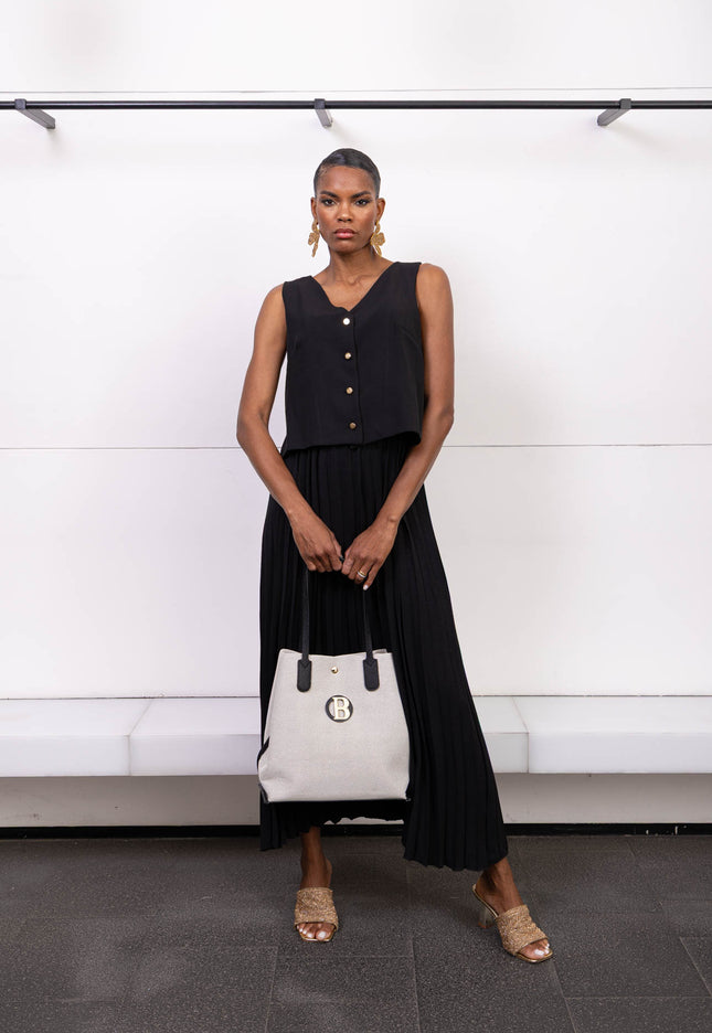 Complete outfit with sleeveless top and long pleated skirt